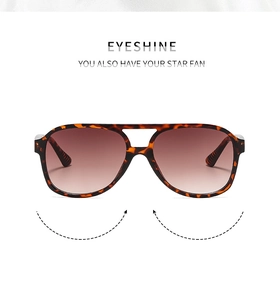 Detail of tortoise shell aviator sunglasses with dual-bridge and brown gradient lenses