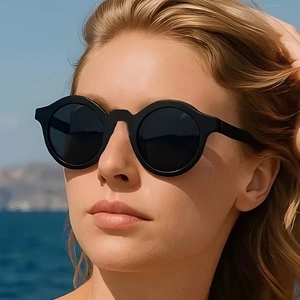 Classic black round oversized sunglasses with matte frames and dark lenses for outdoor use