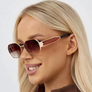 Chic polygonal metal sunglasses with gold frame and brown gradient lenses on model
