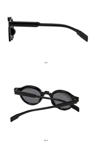 Detail view of the side and back of stylish black round sunglasses with glossy finish