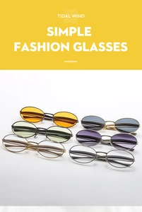 Macro shot of oval metal sunglasses showing six assorted lens colors and slim frame details
