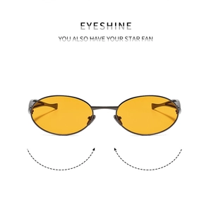 Detail of slim metal sunglasses frame with orange lenses and adjustable temple tips