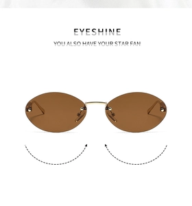 Détail de lunettes de soleil ovales sans monture, pont doré, verres thé et perles