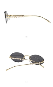 Détails de lunettes de soleil ovales avec monture dorée et branches ornées de perles