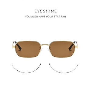 Detailed close-up of retro geometric gold metal frame sunglasses with brown lenses