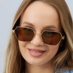 Elegant thin gold metal hexagonal sunglasses with dark brown polarized lenses on model