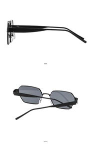 Detail view of black polygonal sunglasses with slim metal frames and silicone nose pads