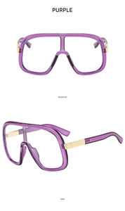 Close-up of purple oversized shield sunglasses featuring elegant gold metal temple accents