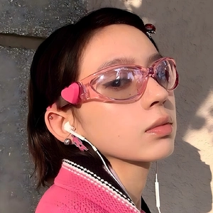 Pink oval frame sunglasses with 3D heart decor on temples for Y2K style aesthetic