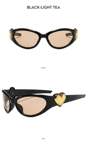 Detail view of oval cat-eye sunglasses with golden heart accent and model number