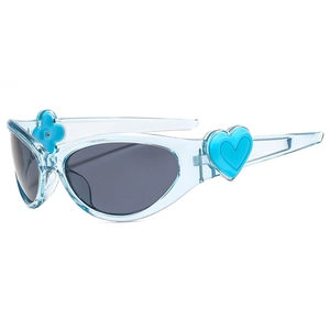 Y2K style light blue oval sunglasses with heart and flower decor on clear frame
