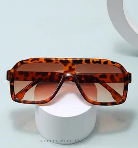 Detail of retro oversized square aviator sunglasses with tortoise shell frame and brown lenses