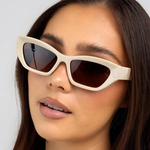 Fashionable creamy cat-eye sunglasses with dark brown lenses for women outdoor style