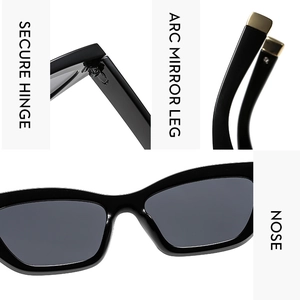 Detail of square cat-eye sunglasses featuring metal hinges and gold-trimmed temple tips