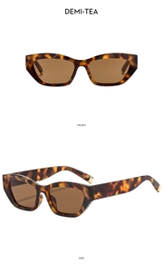 Detail view of demi-tea tortoiseshell cat-eye sunglasses with golden metal hinges