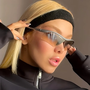 Silver sports goggles with orange gradient lenses and windproof wraparound design