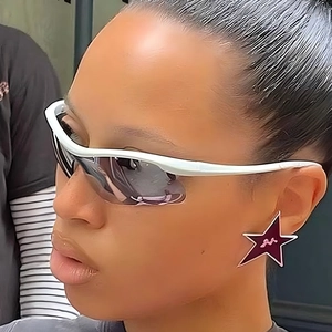 Silver sports sunglasses with white frame and purple star-shaped detail in outdoor street style