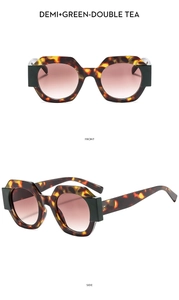 Detail view of tortoiseshell and green polygon frames with double tea gradient lenses