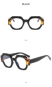 Detailed front and side view of black geometric hexagonal frame glasses with tortoise accent