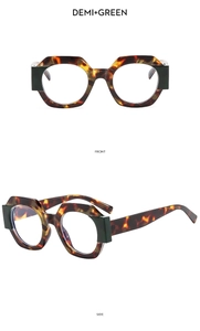 Close-up of vintage polygonal glasses frame in tortoiseshell and green finishes