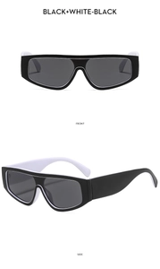 Vues frontale et latérale de lunettes de soleil oversize noir et blanc avec verres gris