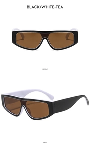 Vues de face et de côté de lunettes de soleil oversize noir et blanc avec verres thé