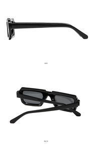 Detail view of side and back angles of thick black rectangular frame sunglasses