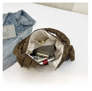 Deep brown quilted cloud bag interior showing large capacity for daily essentials
