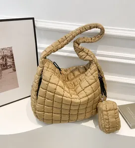 Close-up of khaki quilted puffer tote bag with matching mini round coin purse detail