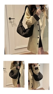 Detail shot of a black nylon oversized crescent bag styled with a beige trench coat