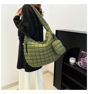 Detail of olive green quilted cloud tote bag with matching mini pouch and wide strap