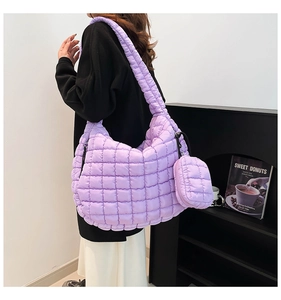 Detail of lavender quilted cloud bag showing soft padded texture and crossbody strap