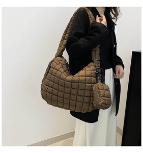 Close-up of caramel padded cloud shoulder bag with matching round coin purse detail