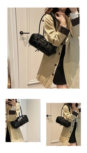 Detail of black patent leather bowling bag featuring decorative double bows and slim strap