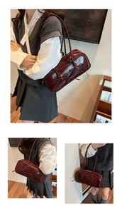 Close-up of wine red glossy handbag with bow details and sleek leather texture