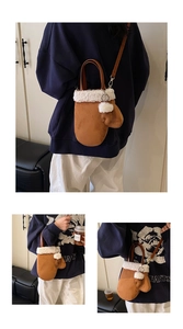 Detail of creative glove-shaped crossbody bag with brown faux suede and white plush trim