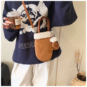 Creative brown suede mitten shaped crossbody bag with white plush trim and handle