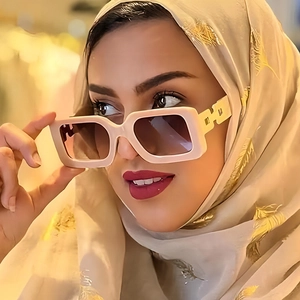 Fashion square thick frame sunglasses with cream frames and gold chain detail on temple