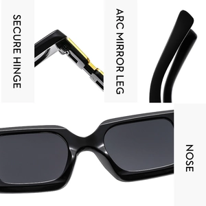 Detail view of secure metal hinges and curved temples on black rectangle sunglasses