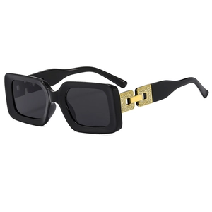 Square black sunglasses with textured gold metal chain detail on the temples