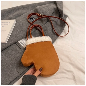 Creative glove-shaped brown suede crossbody bag with soft white faux fur trim detail