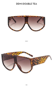 Detailansicht der übergroßen Tortoise-Sonnenbrille mit Verlaufsgläsern in Braun von vorne