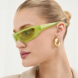 Y2K retro cat-eye sunglasses with translucent light green frames and yellow lenses