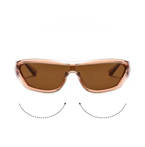 Close-up of futuristic wrap-around sunglasses with transparent pink frames and tinted lens