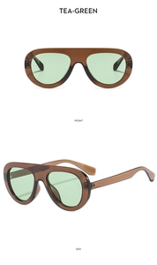 Vues de face et de côté de lunettes de soleil oversize vert thé à monture translucide