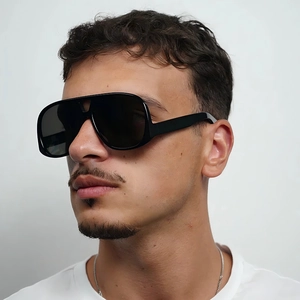 Fashionable oversized aviator sunglasses with black frames and dark polarized lenses