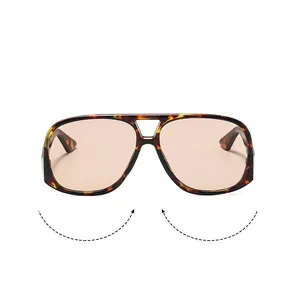 Detail of tortoise aviator sunglasses with dual beam and light orange translucent lenses