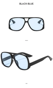 Detail view of large pilot sunglasses with black frame and light blue lenses from front and side