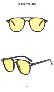 Vues de face et de côté de lunettes aviateur à double pont avec monture noire et verres jaunes