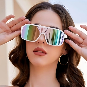 Detail of oversized white sunglasses with vibrant iridescent mirrored lenses on model